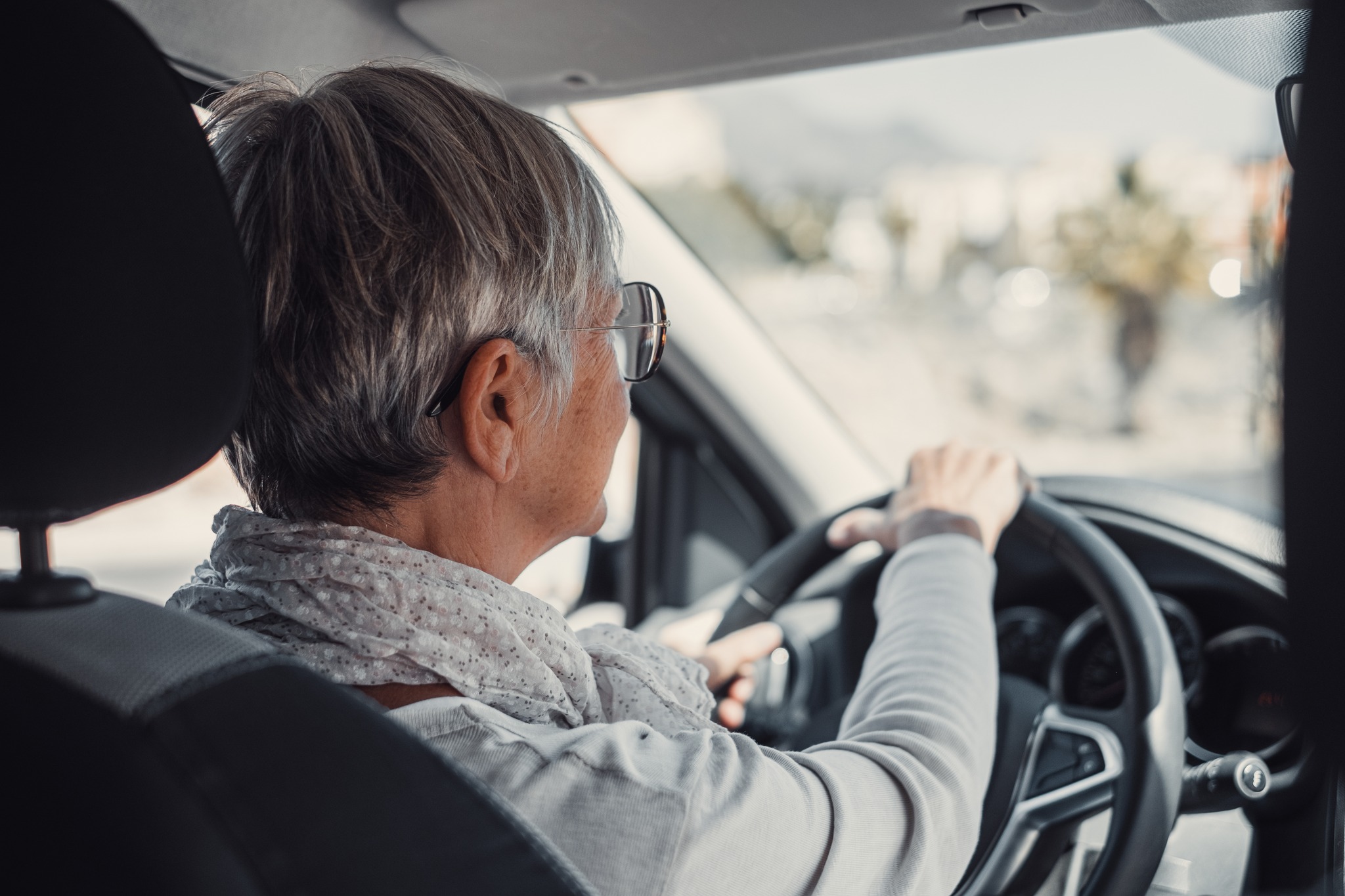 Older woman driving.