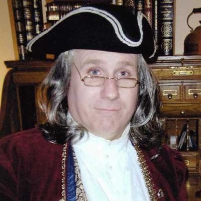 Actor Terry Lynch dressed as Benjamin Franklin