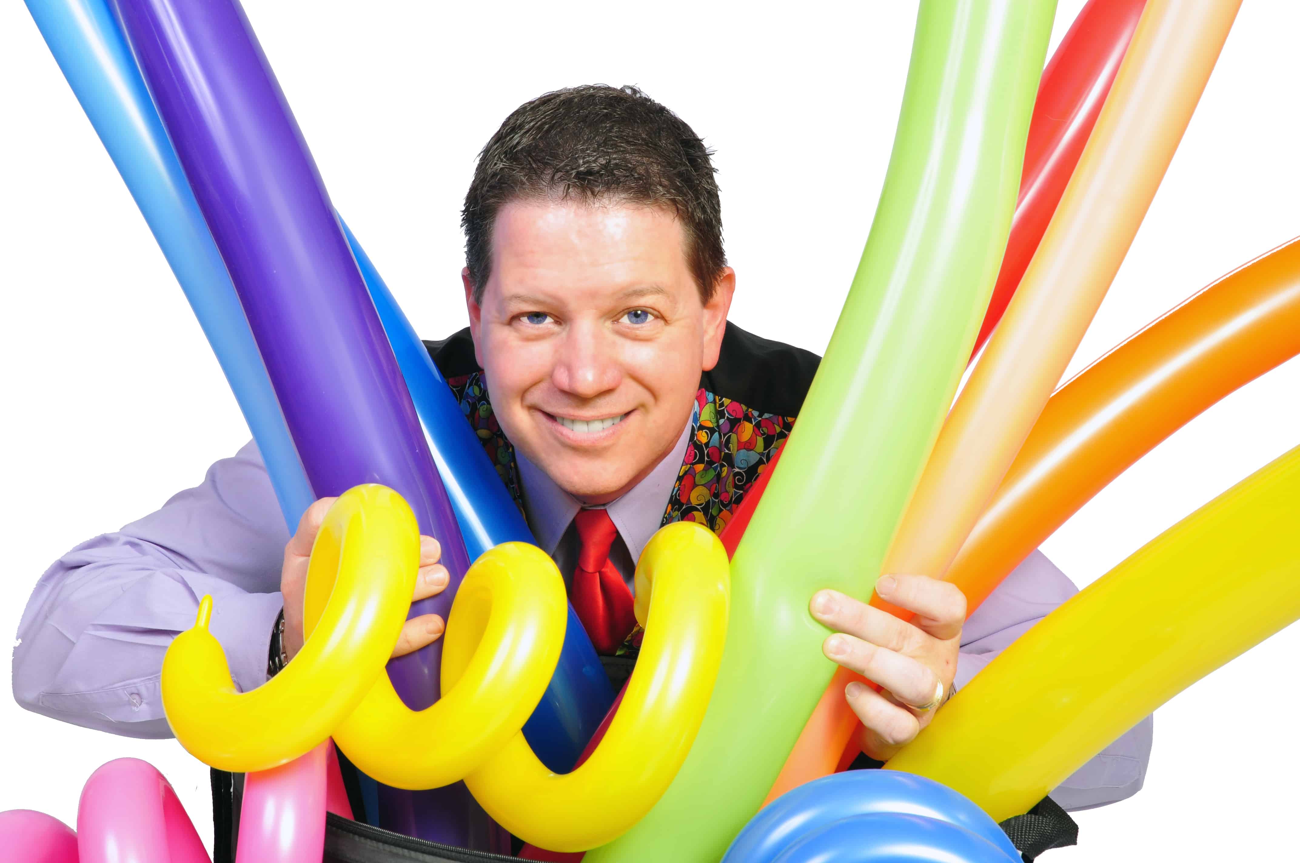 Dale smiling with balloons.