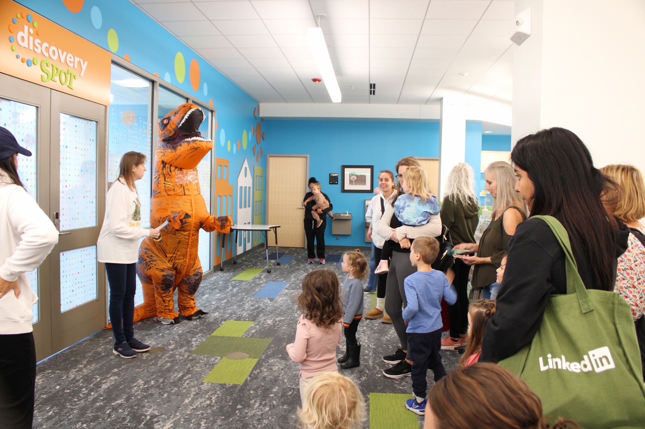 Dinosaur greating crowd at Dino Day