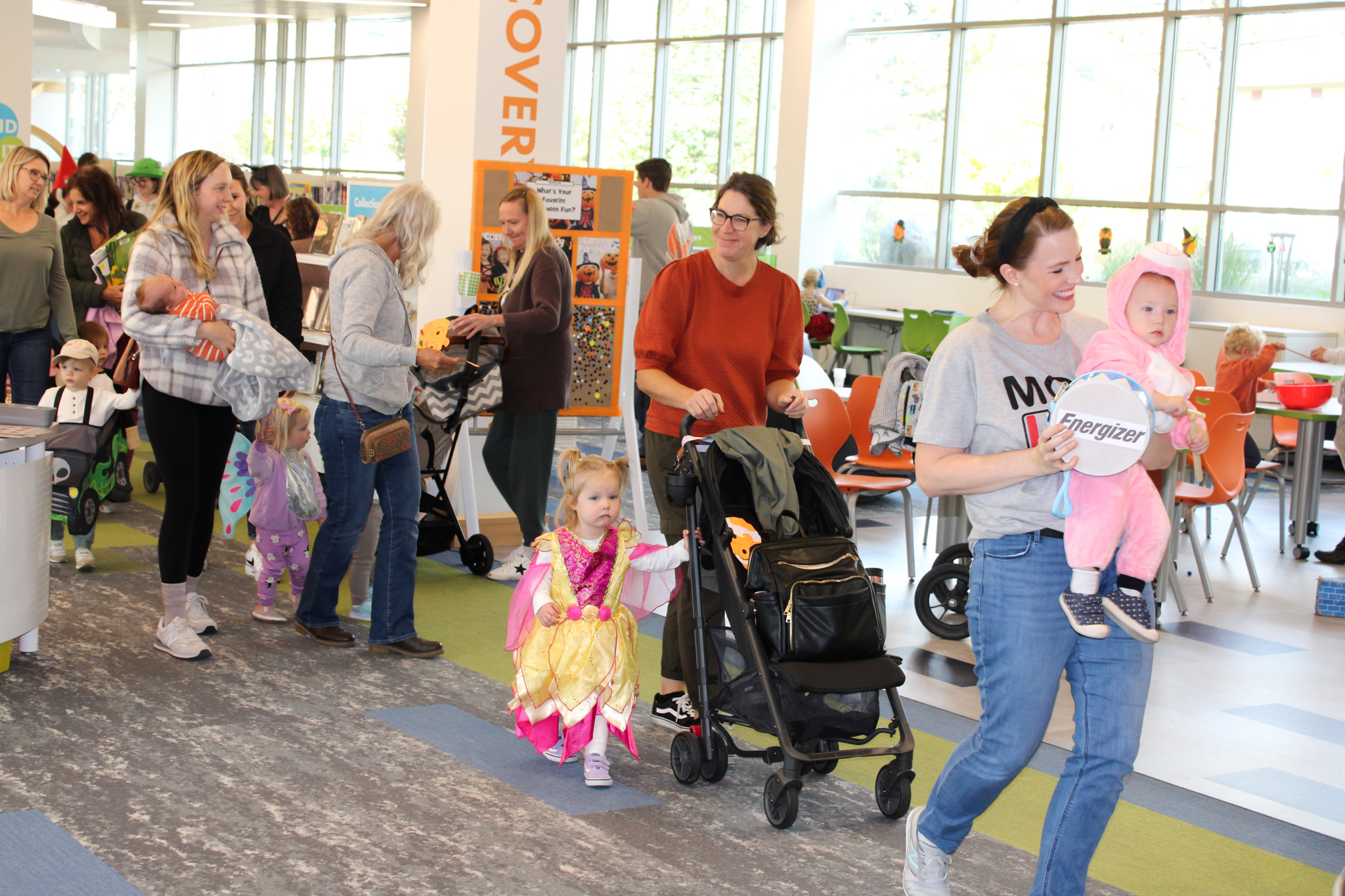Families marching in the Halloween Spooktacular parade