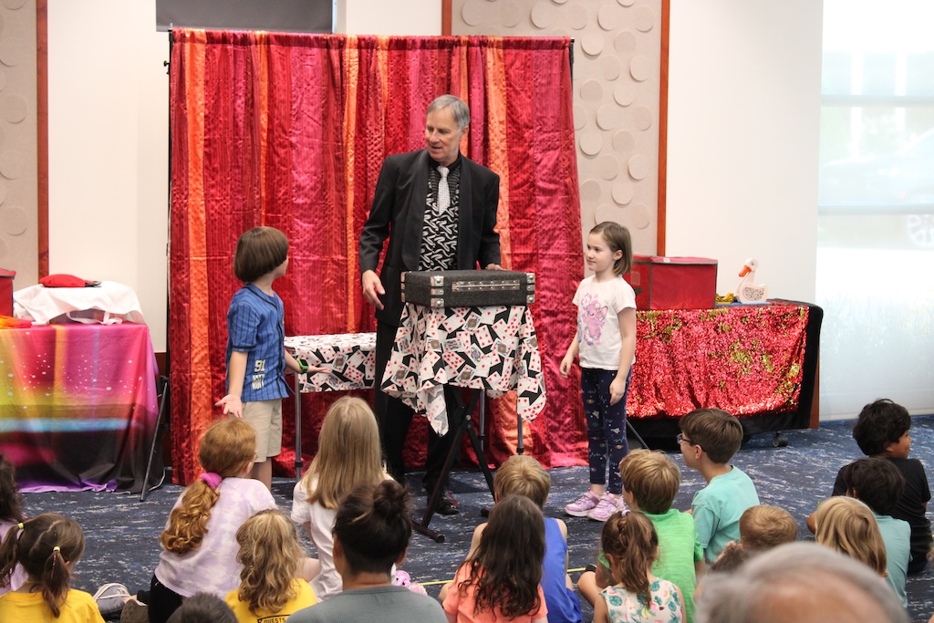 Magician Ken Mate doing a magic show.