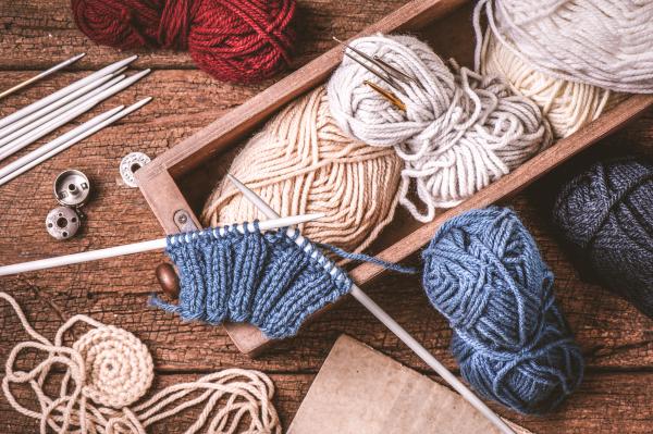 Yarn and knitting needles.