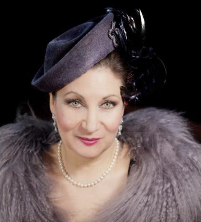 Martina Mathisen dressed us Louella Parsons.