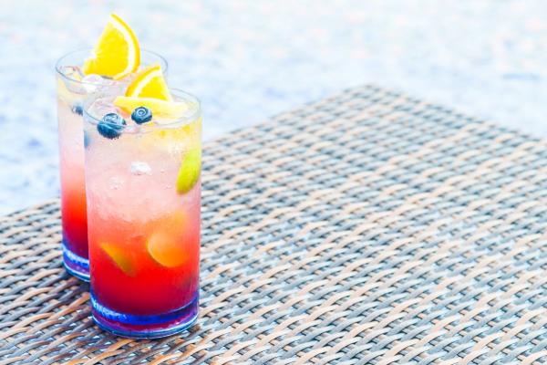 Colorful mocktails with lemons and blueberries.