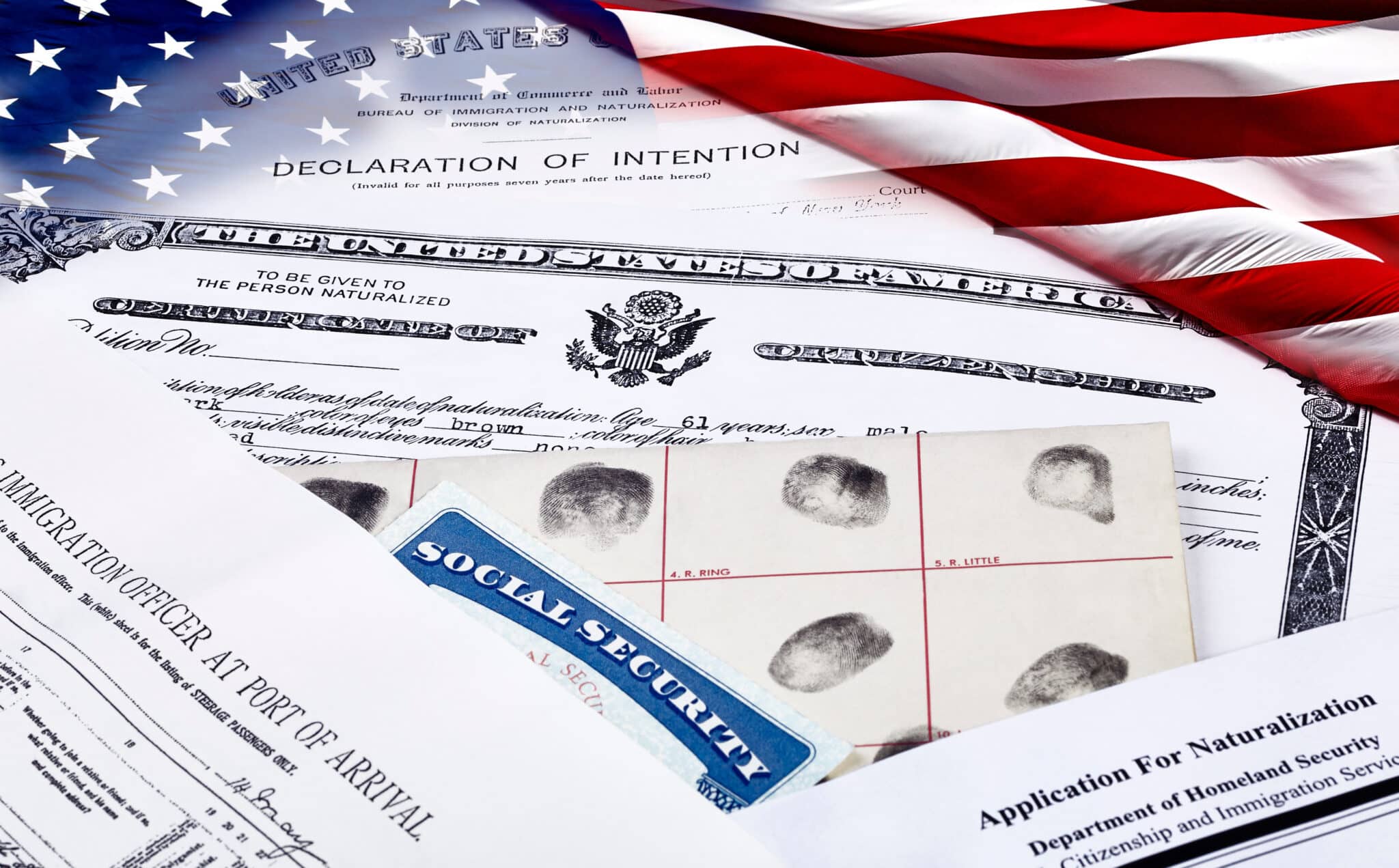 Naturalization records against an American flag.