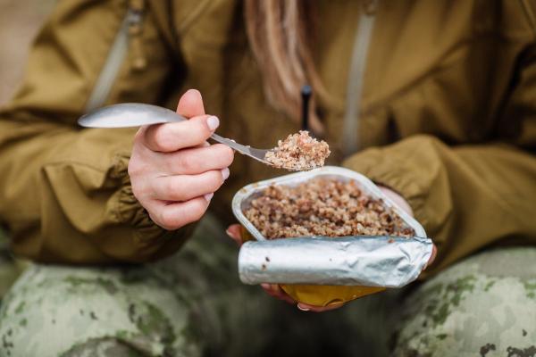 Person holding survival food.