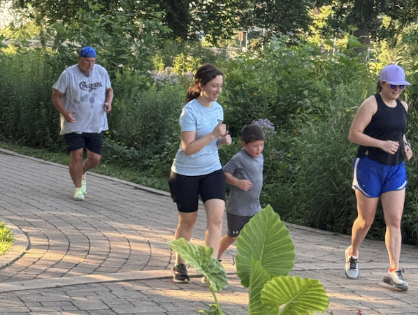 People running in a park.