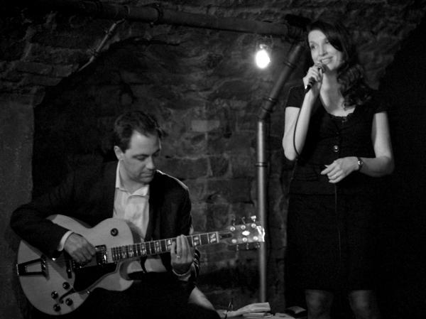 Black and white photo of Petra Van Nuis and guitarist Andy Brown