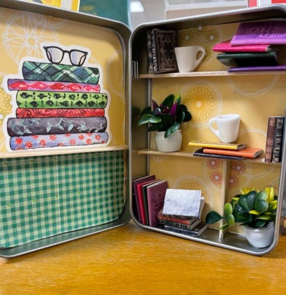 Mini library display created in a tin.