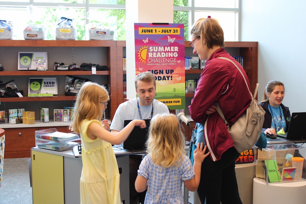 Family signing up for the Summer Reading Challenge