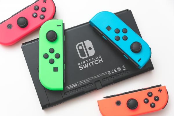 Nintendo Switch and 4 colorful joycons.